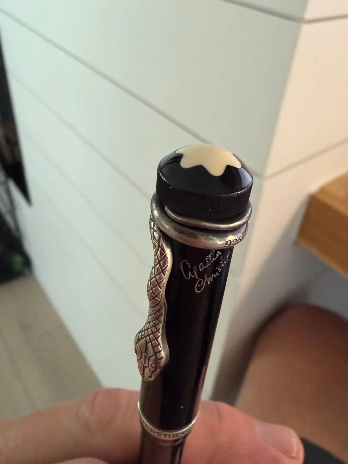 Montblanc Agatha Christie Writers Edition rollerball — cap top with the ivory star, the sterling silver snake clip with ruby eyes, the 925 purity stamp and the Agatha Christie script signature